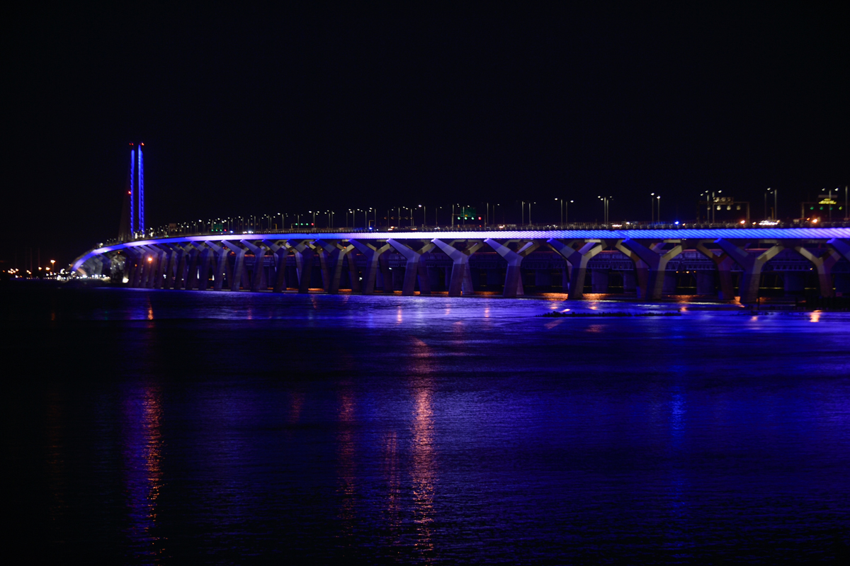 The Samuel De Champlain Bridge illuminated in blue and white for Saint-Jean Baptiste Day, June 24