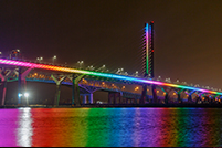 The Samuel De Champlain Bridge illuminated in rainbow colors every Sunday night at sunset